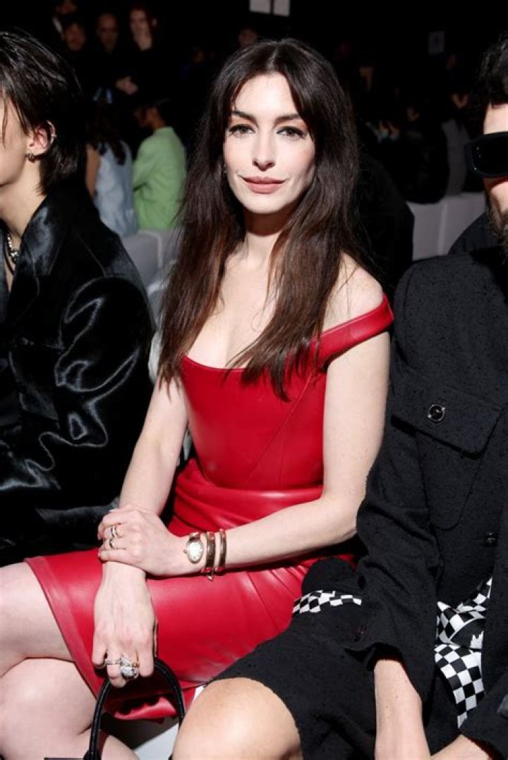 
Fans go into a frenzy as Hwasa seats front row alongside Anne Hathaway at the Valentino Haute Couture Show. 